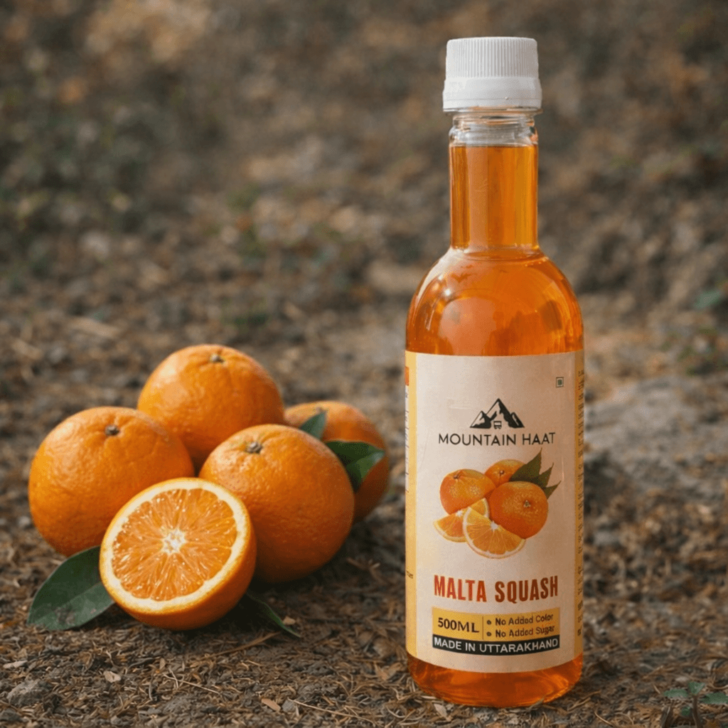 Malta Squash bottle placed with fresh Himalayan malta fruit outdoors