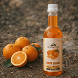 Malta Squash bottle placed with fresh Himalayan malta fruit outdoors