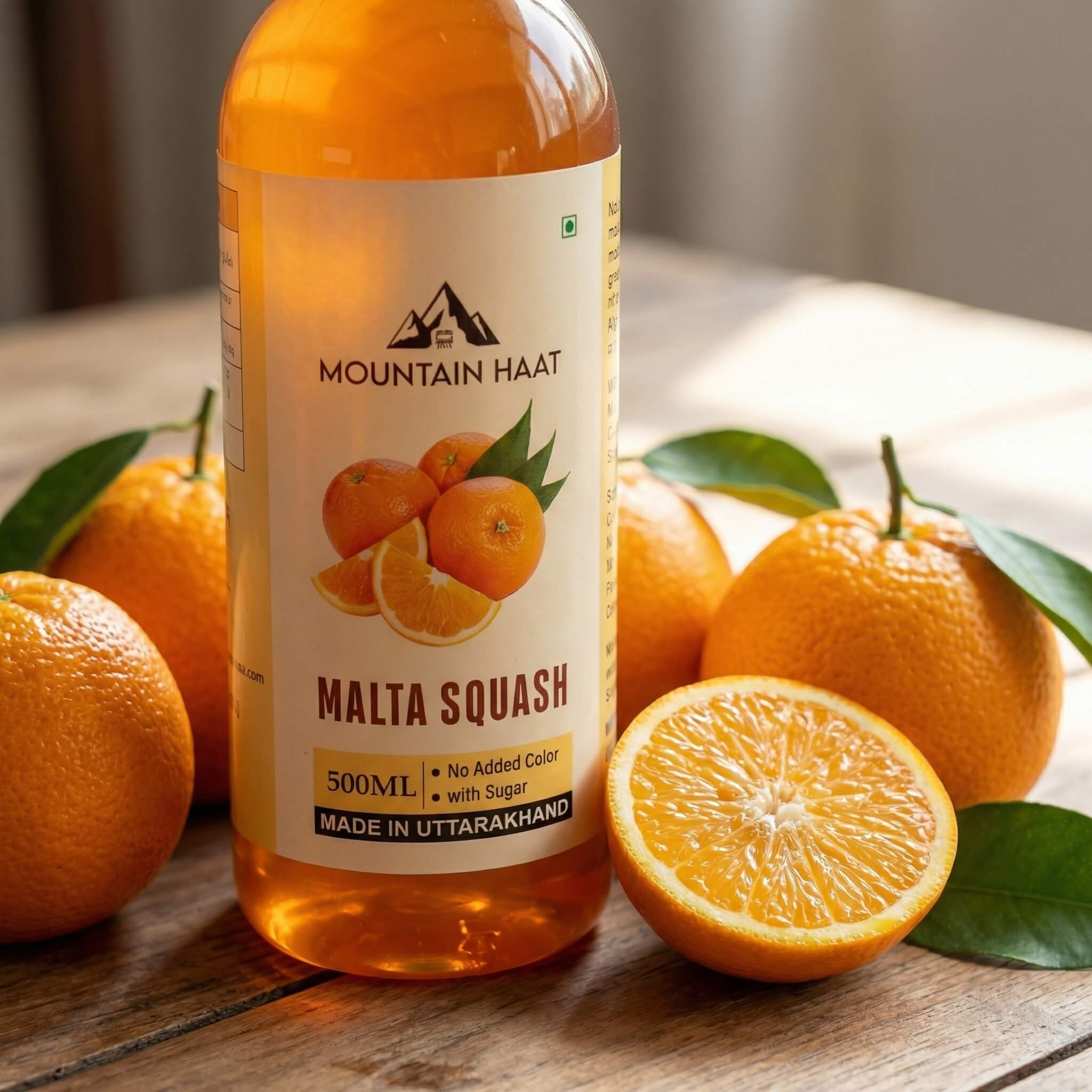 Mountain Haat Malta Squash 500ml classic version placed with fresh Himalayan malta citrus fruits.